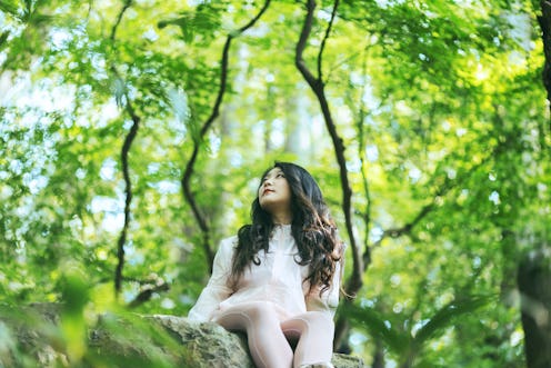 woman sitting in nature