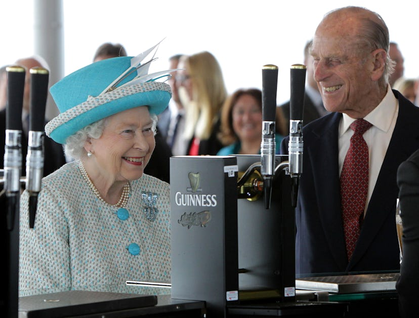 Queen Elizabeth and Prince Philip are all smiles waiting for their Guinness.