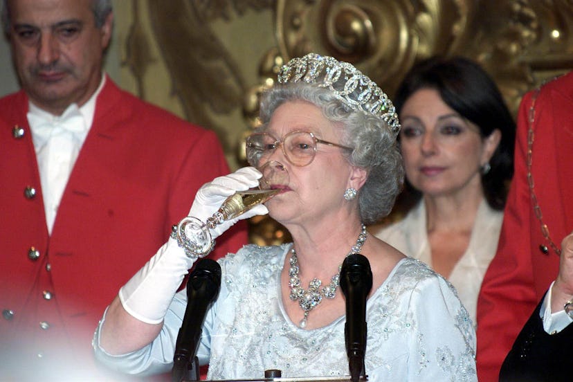 Queen Elizabeth drinks champagne.