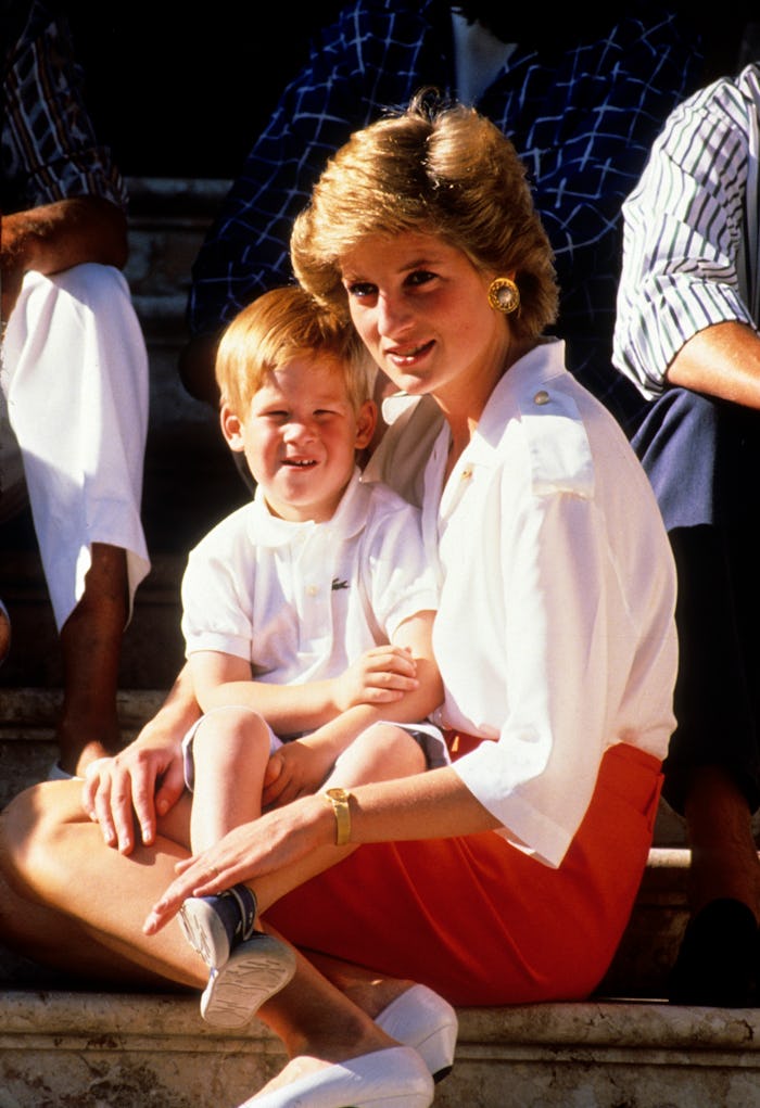 PALMA, MAJORCA - AUGUST 13:  Prince Harry sits on the lap of his mother, Diana, Princess of Wales, w...
