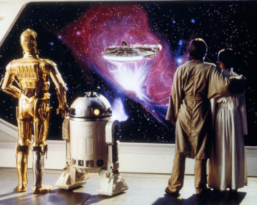 Anthony Daniels, Kenny Baker, Mark Hamill and Carrie Fisher on the set of Star Wars: Episode V; cele...