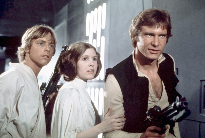 Mark Hamill, Carrie Fisher and Harrison Ford on the set of Star Wars: Episode IV - A New Hope ; cele...