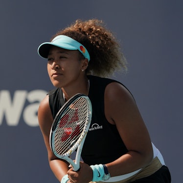 MIAMI GARDENS, FL - MARCH 29: Naomi Osaka (JPN) receives the ball during the fourth round match of t...