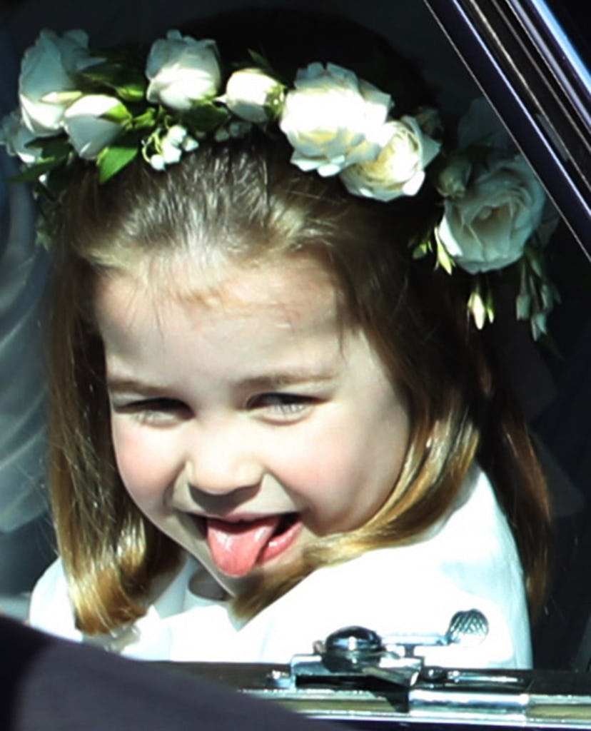 WINDSOR, ENGLAND - MAY 19:  Princess Charlotte rides in a car to the wedding of Prince Harry and Meg...