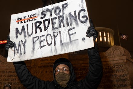 COLUMBUS, OH - APRIL 20: Black Lives Matter activist holds a sign against police brutality in front ...