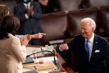 US President Joe Biden turns to Vice President Kamala Harris (C) and Speaker of the House of Represe...