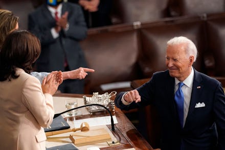 US President Joe Biden turns to Vice President Kamala Harris (C) and Speaker of the House of Represe...
