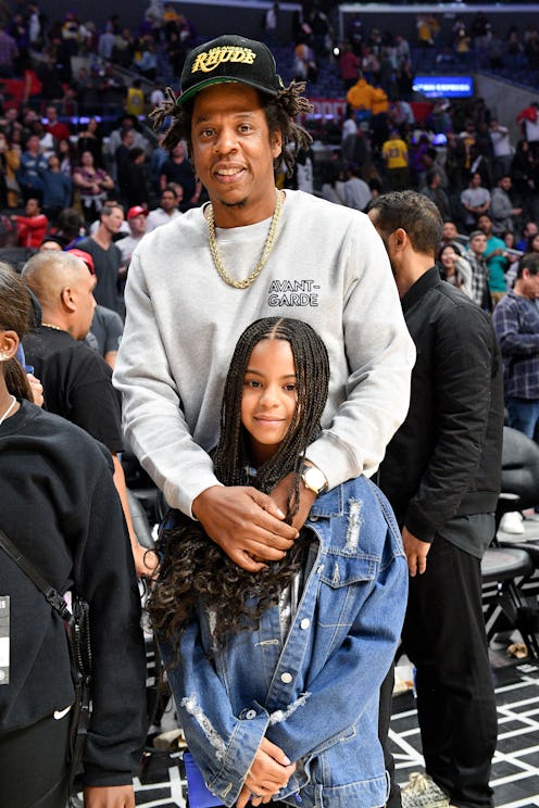 LOS ANGELES, CALIFORNIA - MARCH 08: Jay-Z and Blue Ivy Carter attend a basketball game between the L...