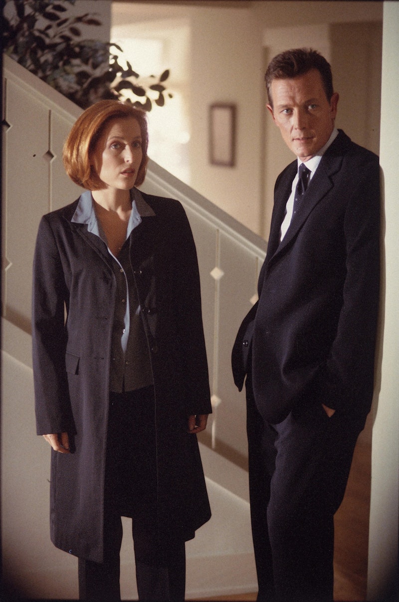 THE X-FILES - SEASON 8:  Agent Dana Scully (Gillian Anderson, R) and Agent John Doggett (Robert Patr...