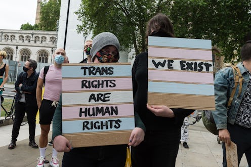Transgender people and their supporters gather in Parliament Square to protest against potential cha...