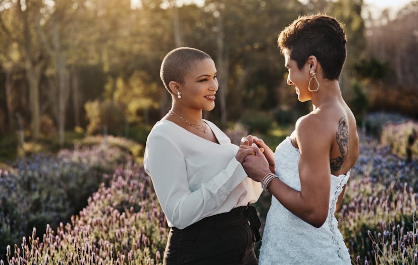 Cropped shot of a young couple standing together on their wedding day