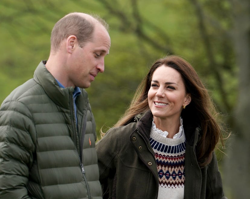 Prince William, Duke of Cambridge and Catherine, Duchess of Cambridge walk together during their vis...