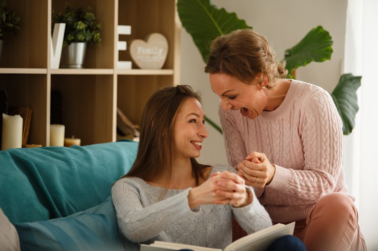 Copy space shot of cheerful mother and daughter having fun and laughing while recreating old memorie...