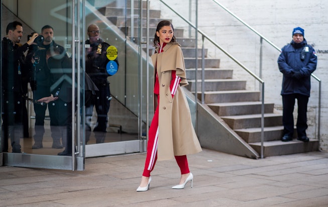 NEW YORK, NY - FEBRUARY 14: Zendaya wearing trench coat, red track suit, white heels seen outside Mi...