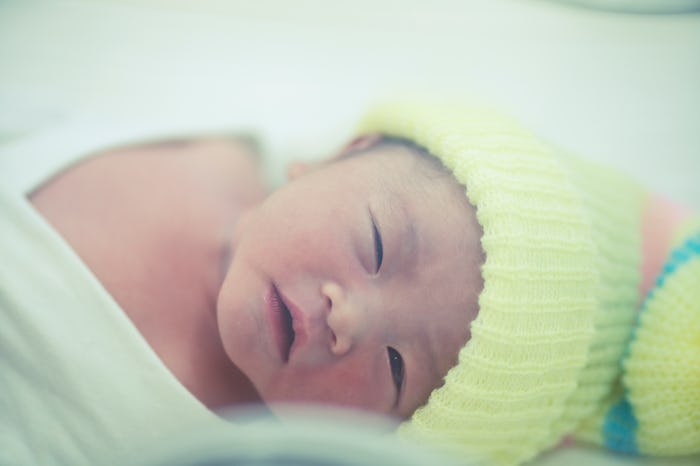 Asian newborn baby crying in a cribs first day new life new world