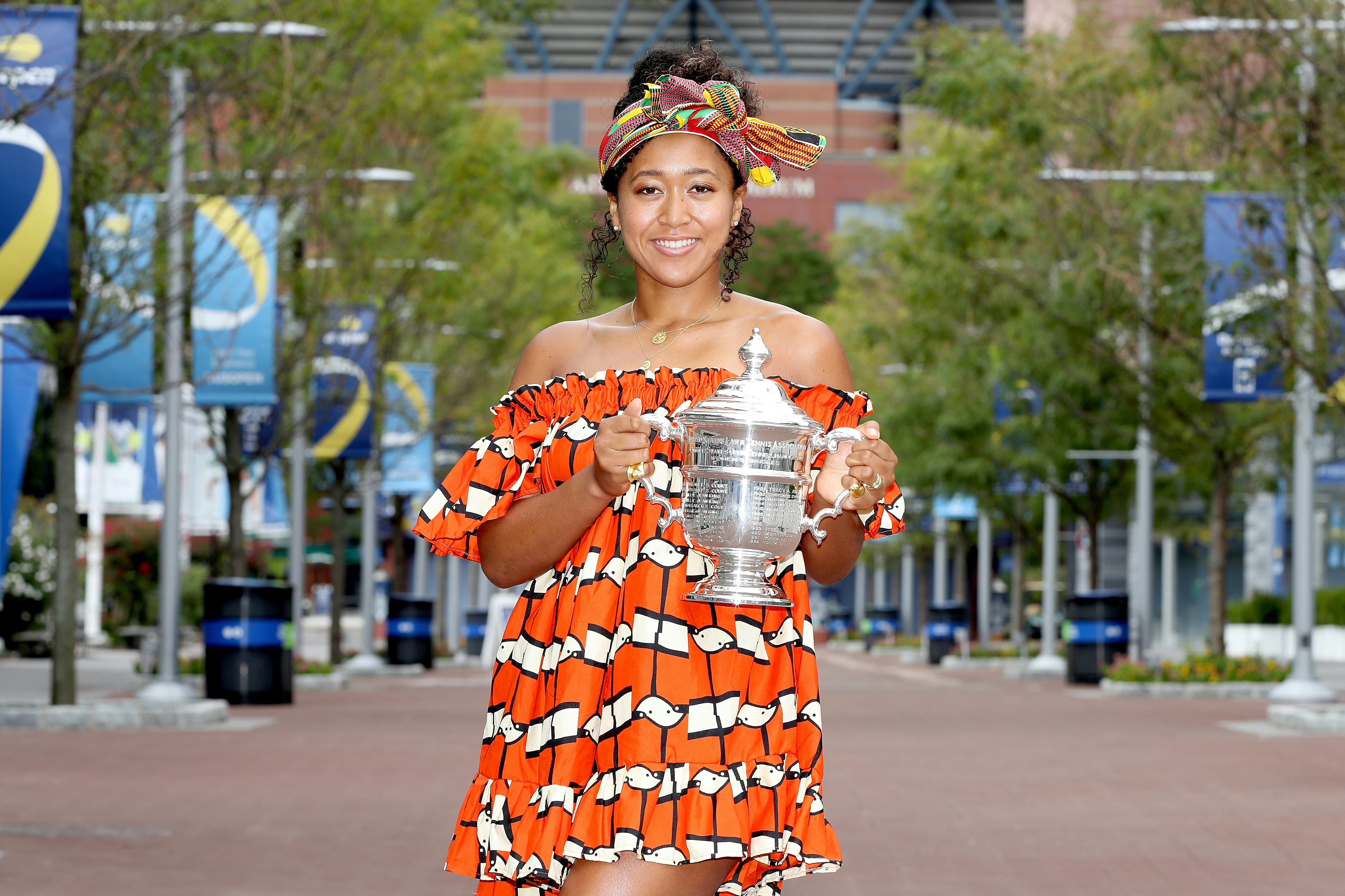 NEW YORK, NEW YORK - SEPTEMBER 13: Naomi Osaka of Japan poses with the US Open trophy the morning af...