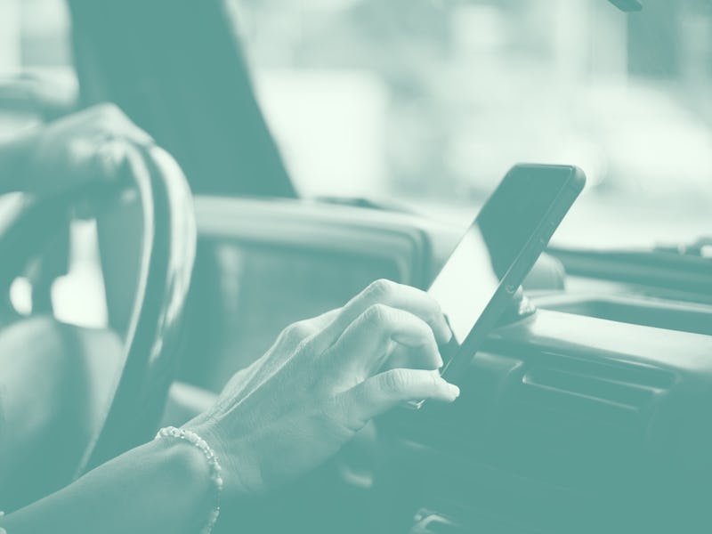 Portrait of woman hands setting up the gps car navigator on the phone - people and internet connecti...