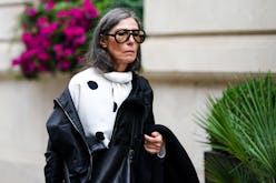 LONDON, ENGLAND - SEPTEMBER 16: A guest wears sunglasses, a white top with printed large polka dots,...