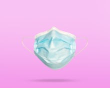 Covid-19 face mask on color background
