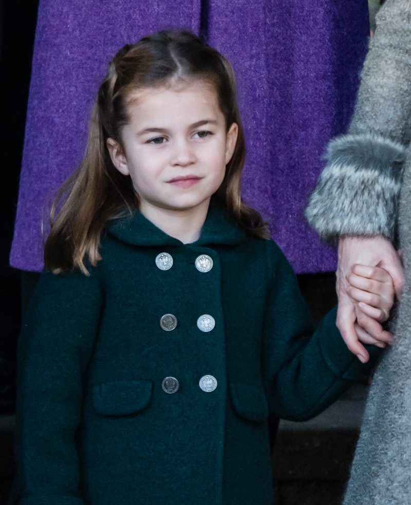 KING'S LYNN, ENGLAND - DECEMBER 25: Princess Charlotte of Cambridge is given a hug by a wellwisher a...