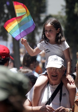 girl on dad's shoulder with pride flag, pride quotes