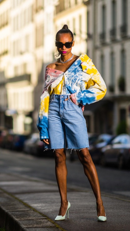 PARIS, FRANCE - MAY 21: Emilie Joseph @in_fashionwetrust wears diamond earrings, a silver chain neck...