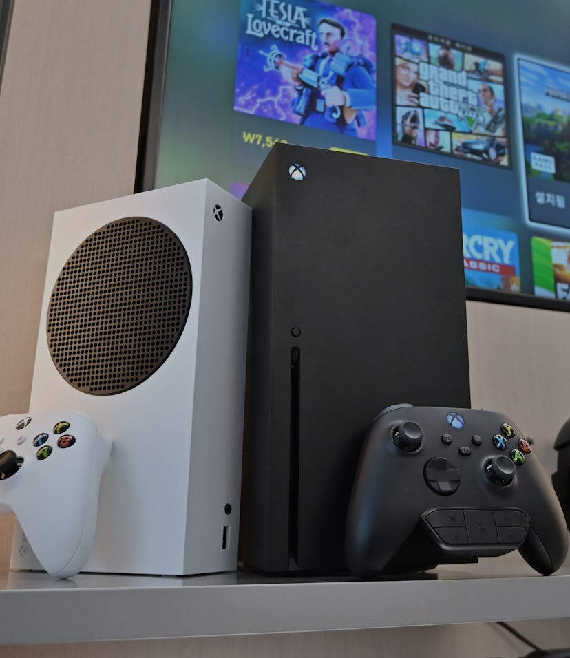 Microsoft's Xbox Series X (black) and series S (white) gaming consoles are displayed at a flagship s...