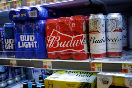 NEW YORK, NY - JULY 26: Cans of Budweiser and Bud Light sit on a shelf for sale at a convenience sto...
