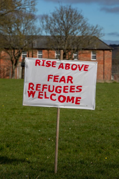 Shoes and banners placed outside Napier Barracks by local residents and community groups to mark the...