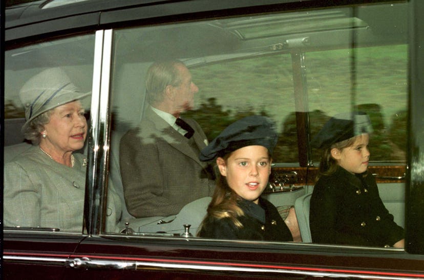 Princess Beatrice and Eugenie drive with their grandparents.
