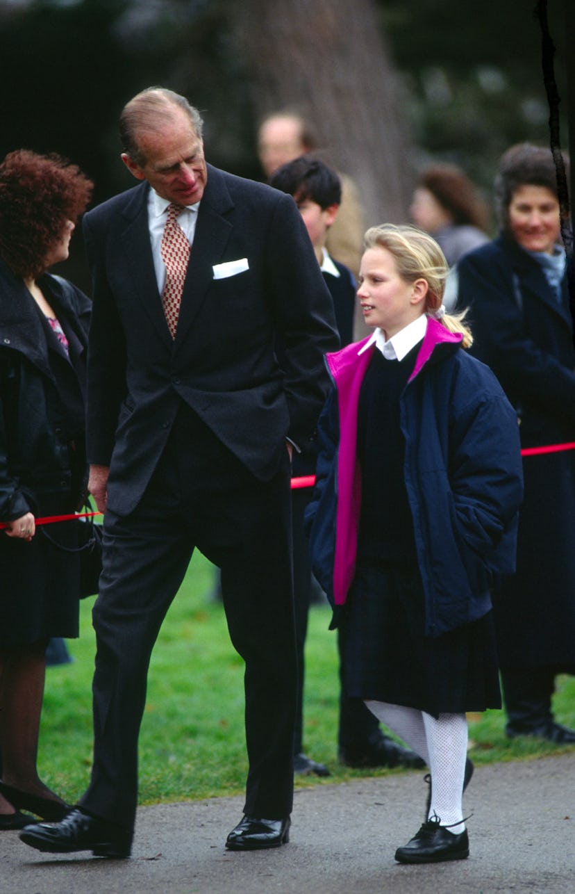 Prince Philip walks with granddaughter Zara.