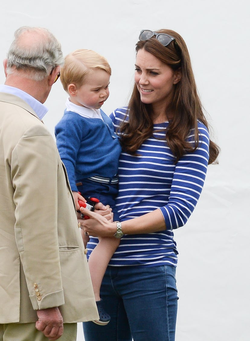 Prince Charles talks to Kate Middleton and Prince George.