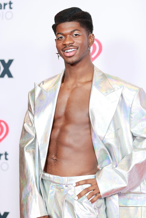 New songs from Lil Nas X, Demi Lovato, & other LGBTQ+ artists to stream for Pride month. Photo via E...