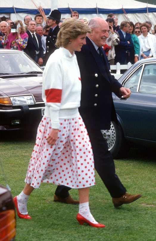 WINDSOR, ENGLAND - JUNE:  Diana, Princess of Wales, wearing a red and white polka dot skirt designed...