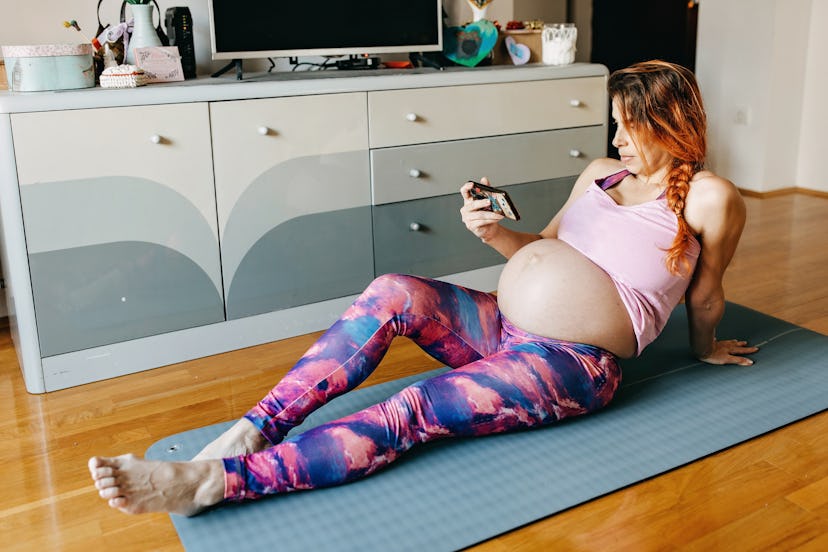 Pregnant woman exercising yoga