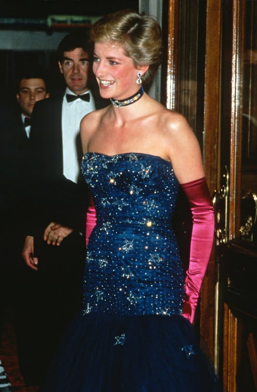 LONDON, ENGLAND - OCTOBER 09: Diana, Princess of Wales, wearing a strapless blue dress designed by M...