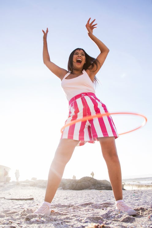 Get your sweat on with TikTok's #hulahoop workouts, a fitness modality that's trending on the app.