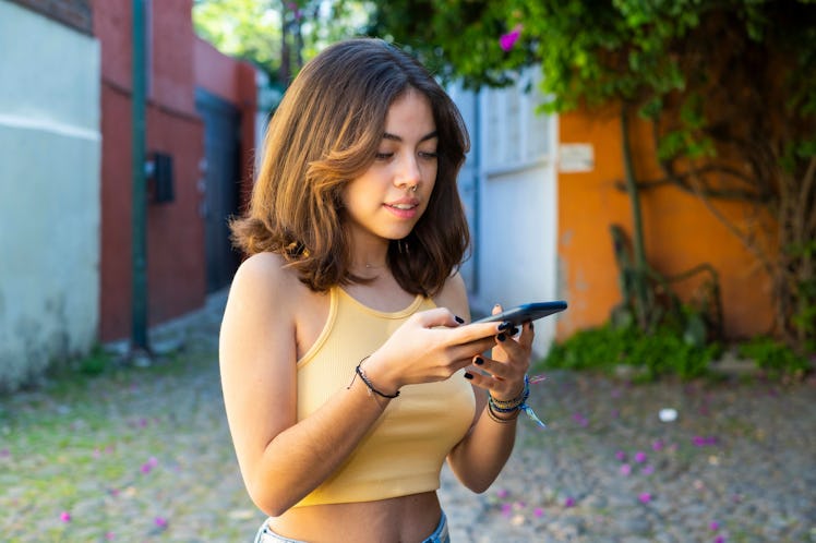 Young woman sends a polite rejection text after a first date.