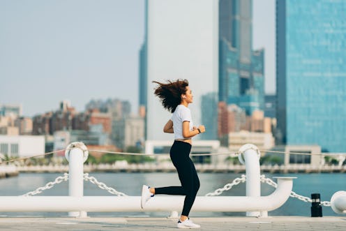 Young sports woman running outdoors