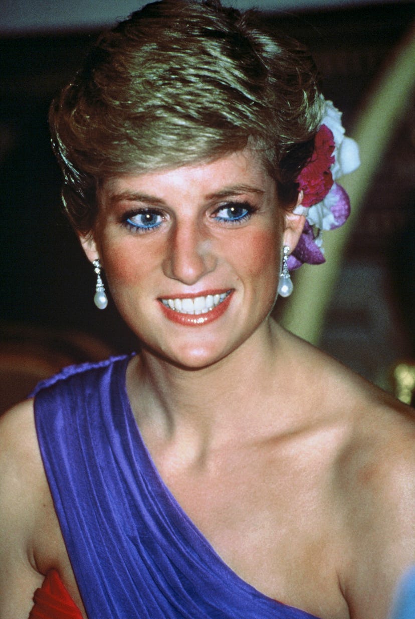 One of Princess Diana's most iconic hair moments: a chic updo with flowers.