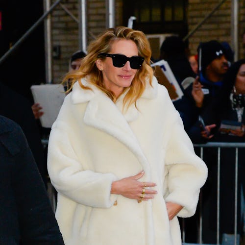 Actor Julia Roberts wears a cream ovesize coat for The Late Show with Stephen Colbert on December 4,...