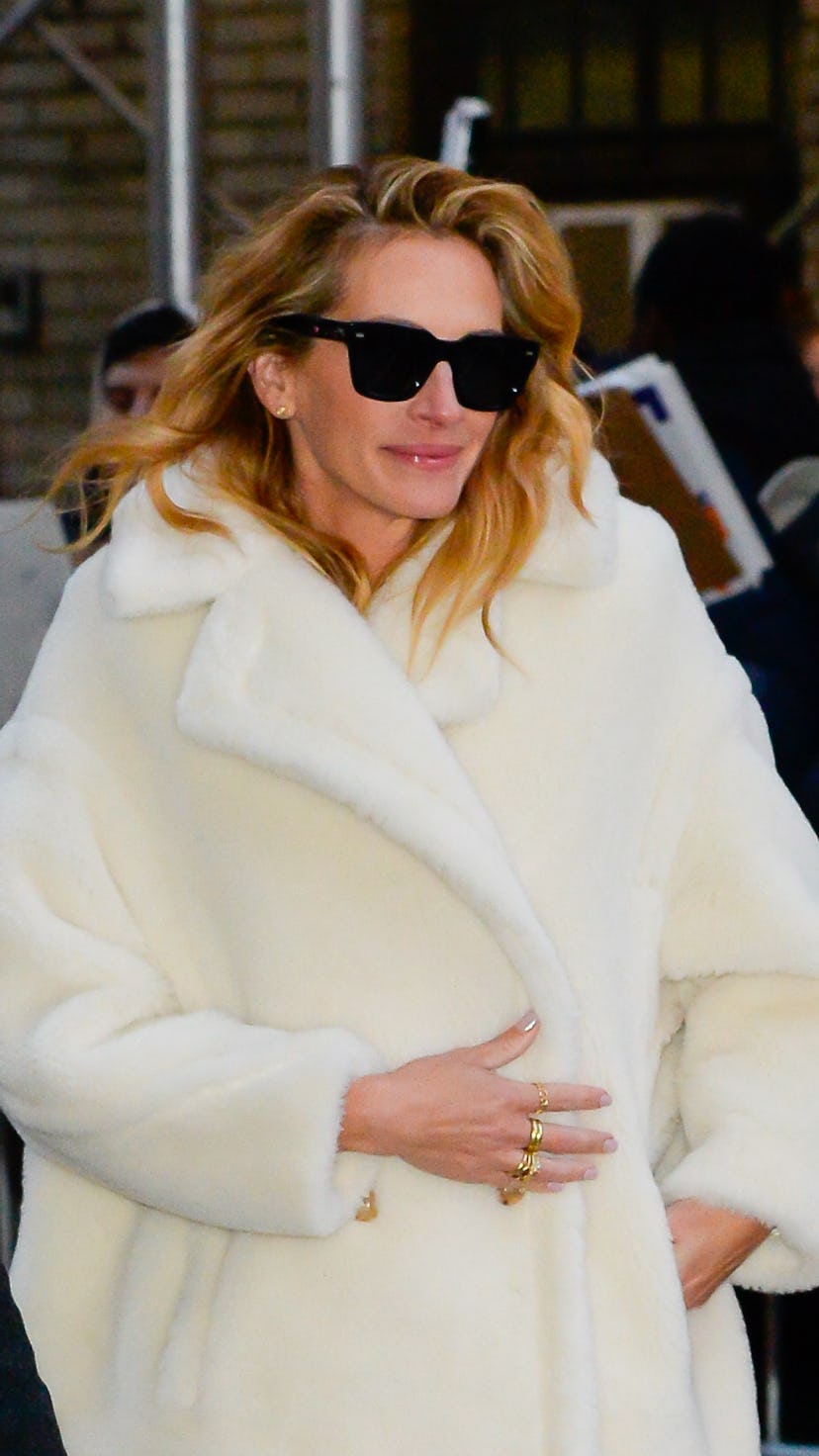 Actor Julia Roberts wears a cream ovesize coat for The Late Show with Stephen Colbert on December 4,...