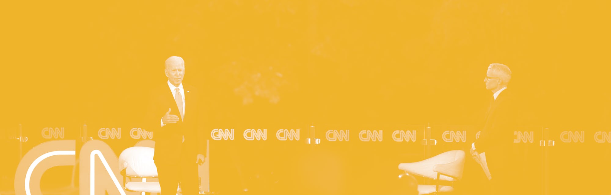 Democratic presidential candidate Joe Biden (L) speaks, alongside journalist Anderson Cooper, during...