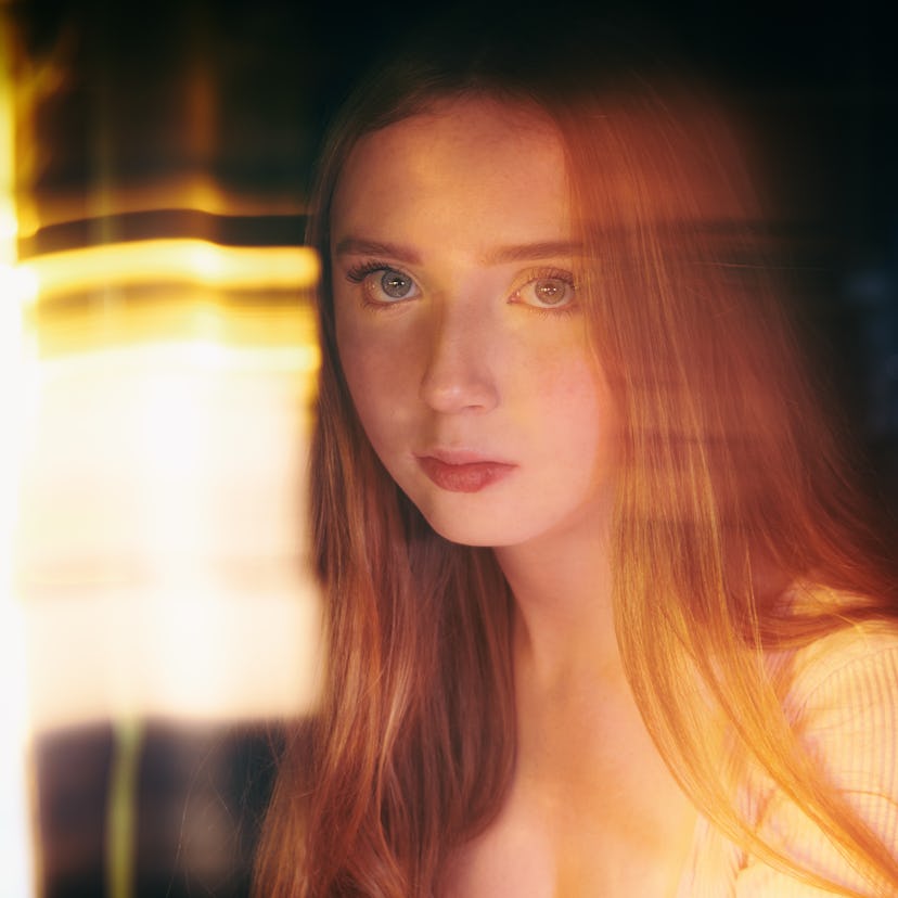 Young redhead woman struggling during the June 2021 full moon.
