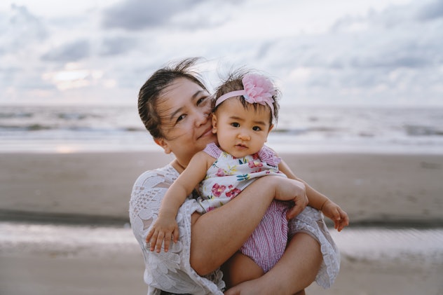 mom with baby girl on beach