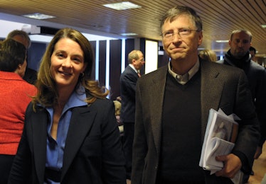 Bill Gates in a black sweater and black blazer and Melinda Gates in a blue shirt and a black blazer