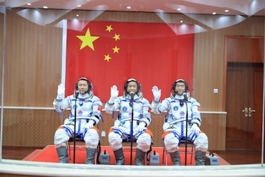JIUQUAN, CHINA - JUNE 17: (L-R) Astronauts Tang Hongbo, Nie Haisheng and Liu Boming attend a see-off...