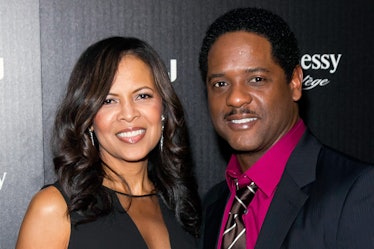 Blair Underwood in a black blazer, red shirt and white-black tie and Desiree DaCosta in a black dres...