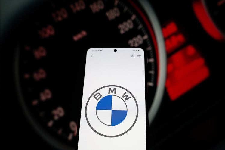 CHINA - 2021/05/28: In this photo illustration a car brand logo "BMW" seen displayed on a smartphone...