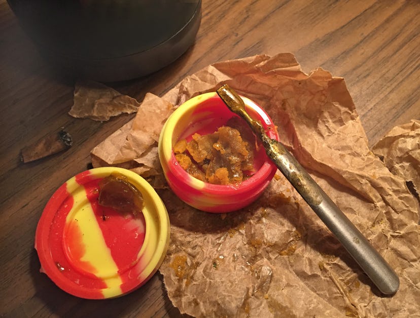 Butane hash oil, aka dabs, in a rubber container. The side effects of smoking dabs can include injur...